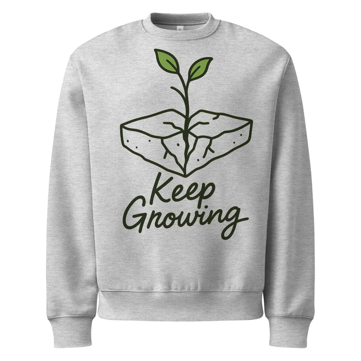 Gray sweatshirt with 'Keep Growing' graphic design on a white background