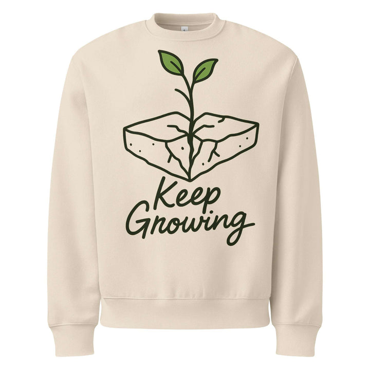 Beige sweatshirt with a plant graphic and 'Keep Growing' text on a white background